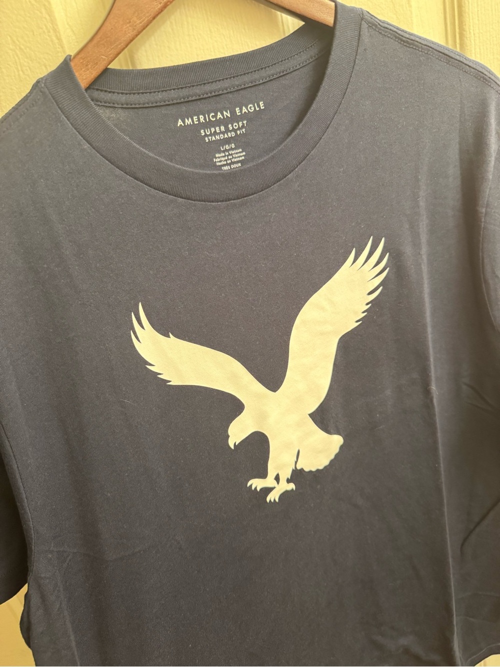 American Eagle Outfitters Men's Super Soft Navy Graphic Tee with Gold Eagle Logo